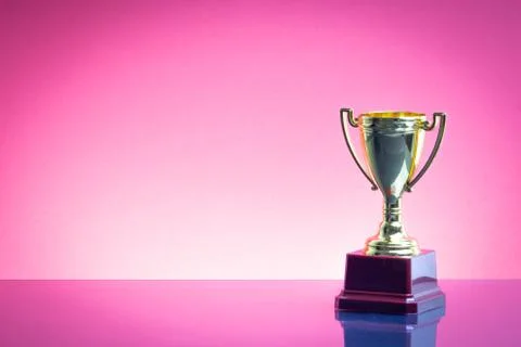 Trophy on the red background. Selective focus 스톡 사진