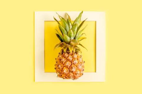 Tropical abstract background, pattern with coconut and pineapple, on yellow Stock Photos
