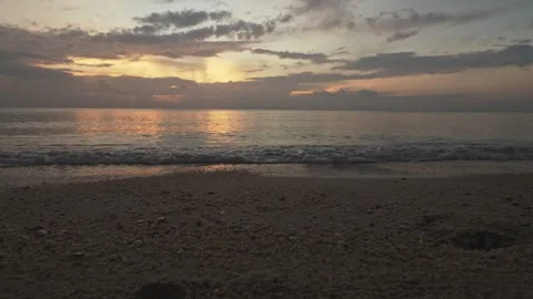 Tropical Beach After Sunset with Sandy Foreground and Calm Sea 스톡 동영상 334019681
