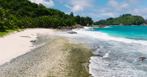 A tropical beach and a blue ocean. Seychelles, Mahe. Stock Footage 310288043