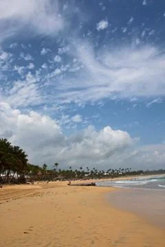 Tropical beach and clouds Stock Photos