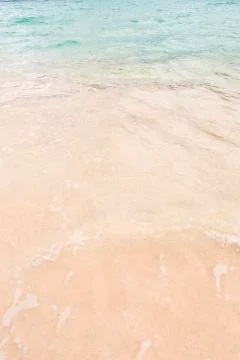 Tropical beach background with soft wave and sand Stock Photos