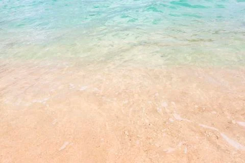 Tropical beach background with soft wave and sand Stock Photos