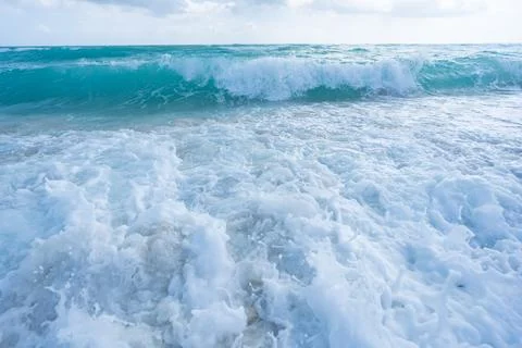 Tropical beach. Beautiful sea pattern. Clean water surface. Calm ocean motion Stock Photos