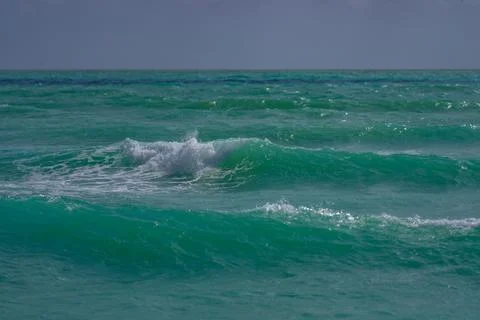 Tropical beach. Beautiful sea pattern. Clean water surface. Calm ocean motion Stock Photos