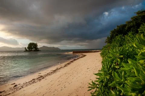 Tropical beach with dramatic sky Stock Photos