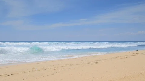 Tropical beach with high tide waves and splashes on sand with trails Stock Footage 114988492