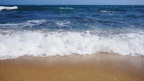 Tropical beach. Ocean wave background. Sand and blue sea. Summer sea vacation Stock Photos