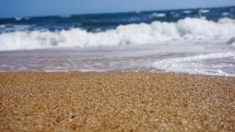 Tropical beach. Ocean wave background. Sand and blue sea. Summer sea vacation Stock Photos