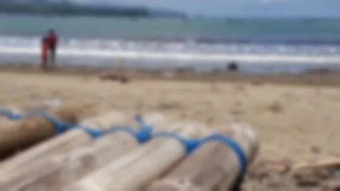 Tropical Beach Ocean Wave Sand Bamboo Raft Disaster Background Blur Template Stock Footage 323084033