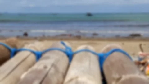 Tropical Beach Ocean Wave Sand Bamboo Raft Disaster Background Blur Template Stock Footage 323084035