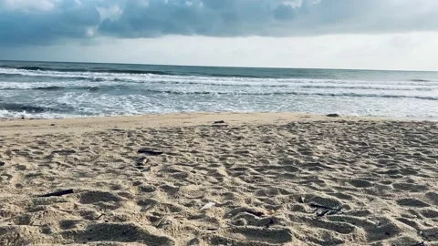 Tropical beach with ocean waves and cloudy sky Stock Footage 328132467