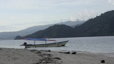 Tropical beach scene with mountains in the background Video stock 247751764
