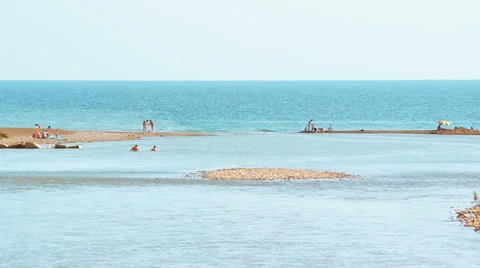 Tropical beach with the sea on one side and a river on another side Stock Footage 65997548