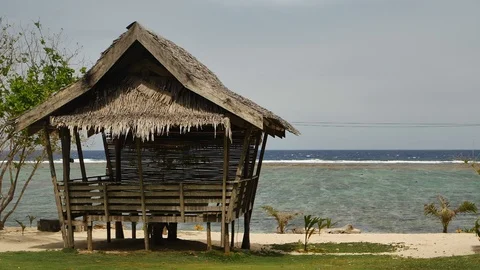 A tropical beach shack on the ocean Video stock 109844011