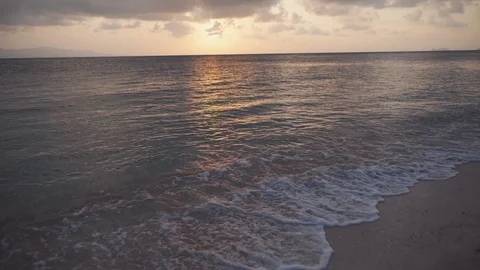 Tropical beach at sunset Stock Footage 125259895