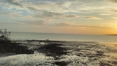 Tropical Beach Sunset at Low Tide with Traditional Fishing Boat Stock Footage 340465085