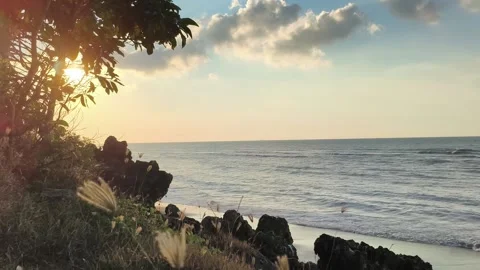 Tropical Beach Sunset over Rocky Shore with Ocean Waves Stock Footage 340340145