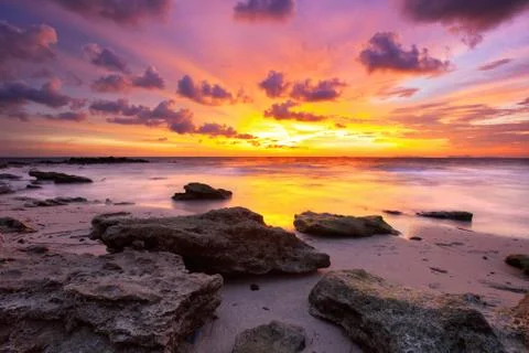 Tropical beach at sunset. Stock Photos