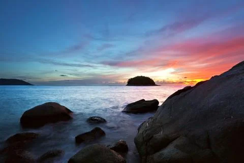 Tropical beach at sunset. Stock Photos