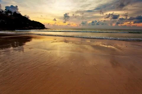 Tropical beach at sunset. Stock Photos