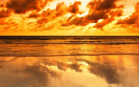 Tropical beach at sunset. Stock Photos