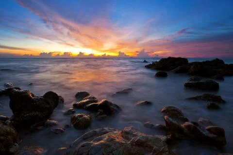 Tropical beach at sunset. Stock Photos
