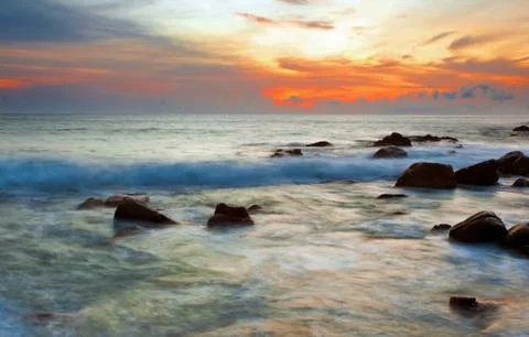 Tropical beach at sunset. Stock Photos