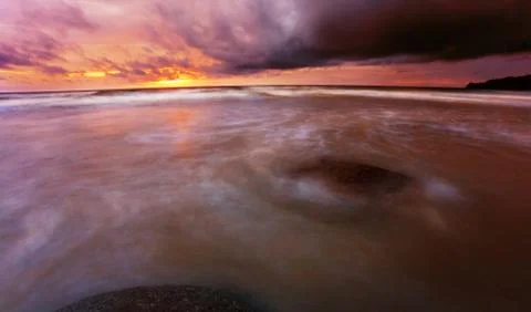 Tropical beach at sunset. Stock Photos