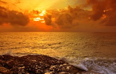 Tropical beach at sunset. Stock Photos