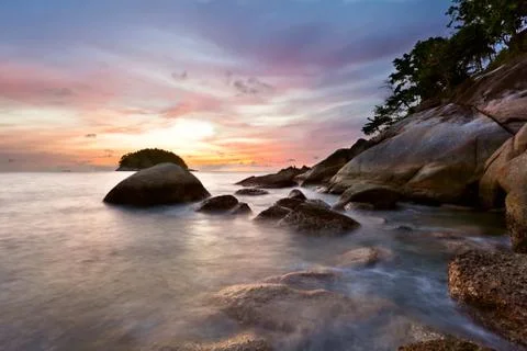 Tropical beach at sunset. Stock Photos