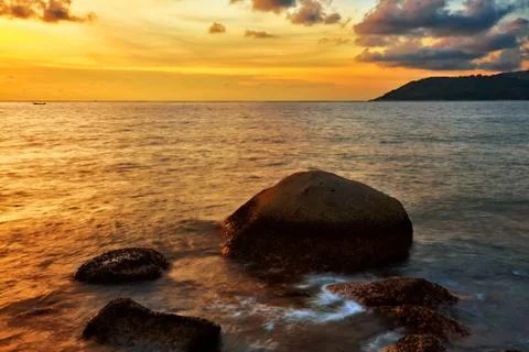 Tropical beach at sunset. Stock Photos