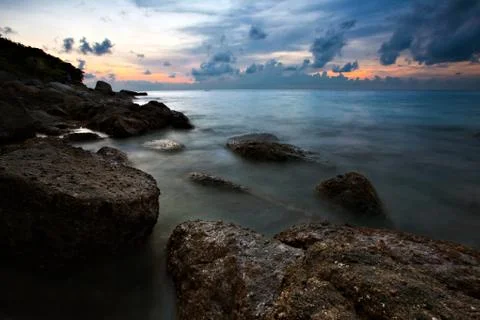 Tropical beach at sunset. Stock Photos