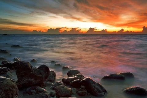 Tropical beach at sunset. Stock Photos
