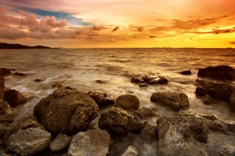Tropical beach at sunset. Stock Photos