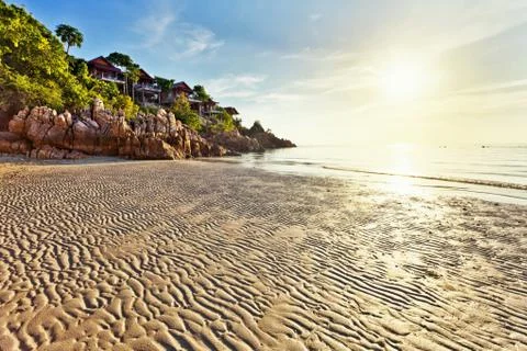 Tropical beach at sunset. Stock Photos