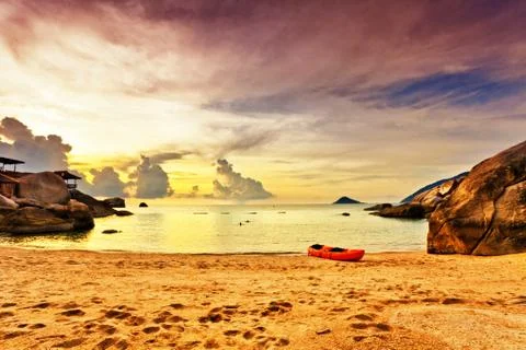 Tropical beach at sunset. Stock Photos