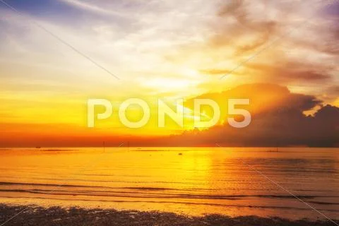 Tropical beach at sunset. Stock Photos