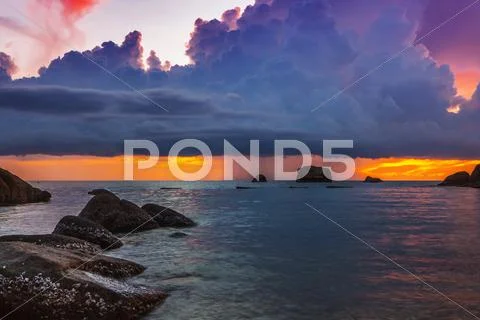 Tropical beach at sunset. Stock Photos