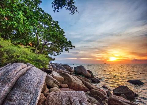 Tropical beach at sunset. Stock Photos