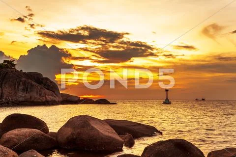 Tropical beach at sunset. Stock Photos