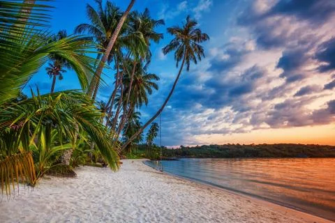 Tropical beach at sunset. Stock Photos