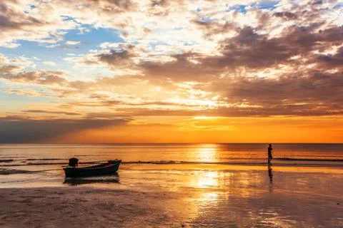 Tropical beach at sunset. Stock Photos