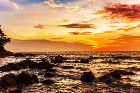 Tropical beach at sunset. Stock Photos
