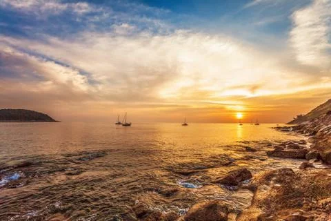 Tropical beach at sunset. Stock Photos