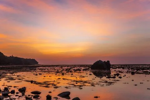 Tropical beach at sunset. Stock Photos
