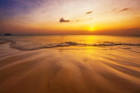 Tropical beach at sunset. Stock Photos