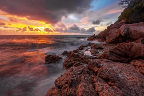 Tropical beach at sunset. Stock Photos