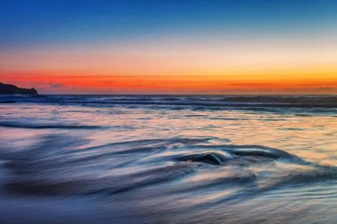 Tropical beach at sunset. Stock Photos