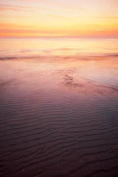 Tropical beach at sunset. Stock Photos